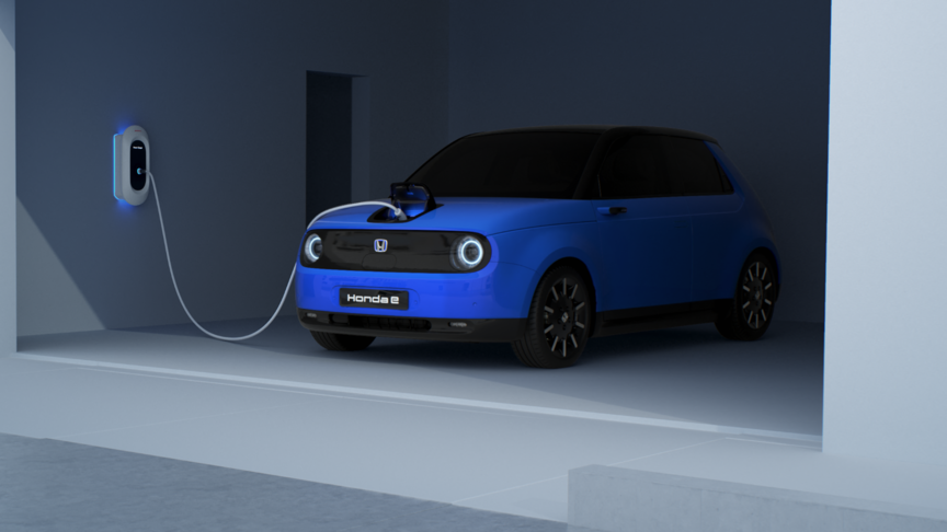 Front three-quarter view hond e charging in garage