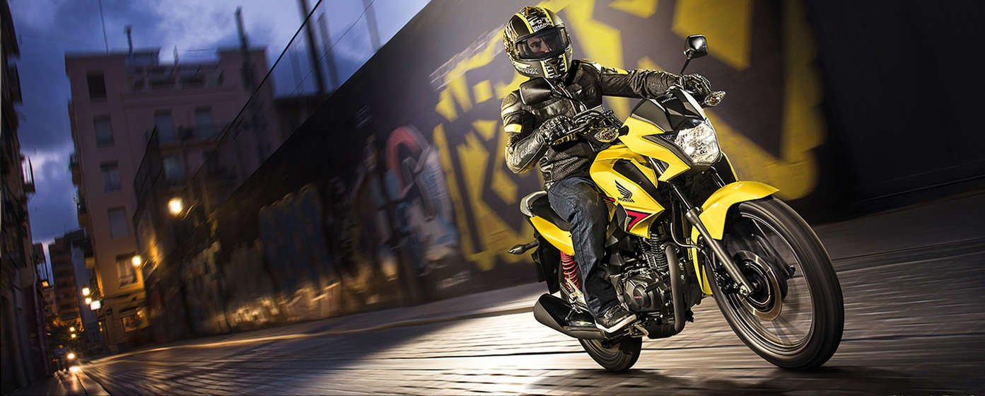 Side shot, msx125 against urban background.