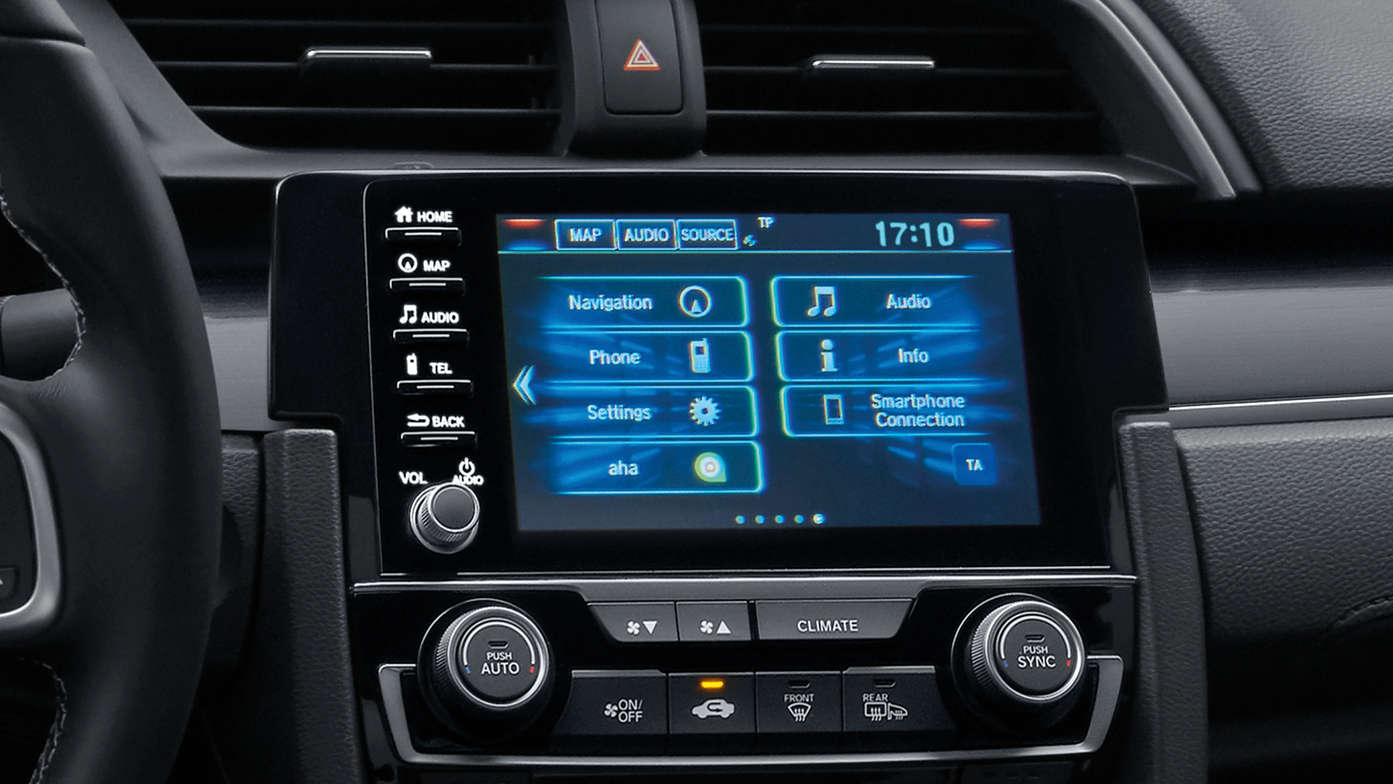 Plan rapproché des boutons de la climatisation de la Honda Civic 4 portes.