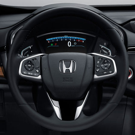 Gros plan sur le volant multifonctions du Honda CR-V.