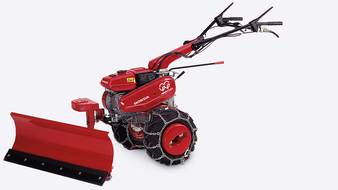 Vue de c&ocirc;t&eacute; de la motobineuse compacte avec pelle &agrave; neige.