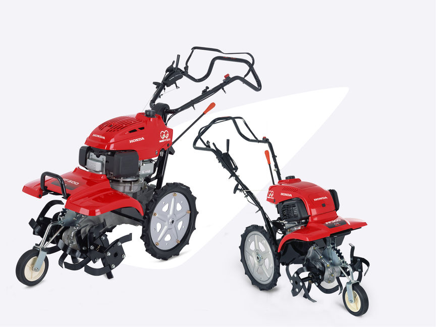 Deux motobineuses équipées d'outils rotatifs Honda.
