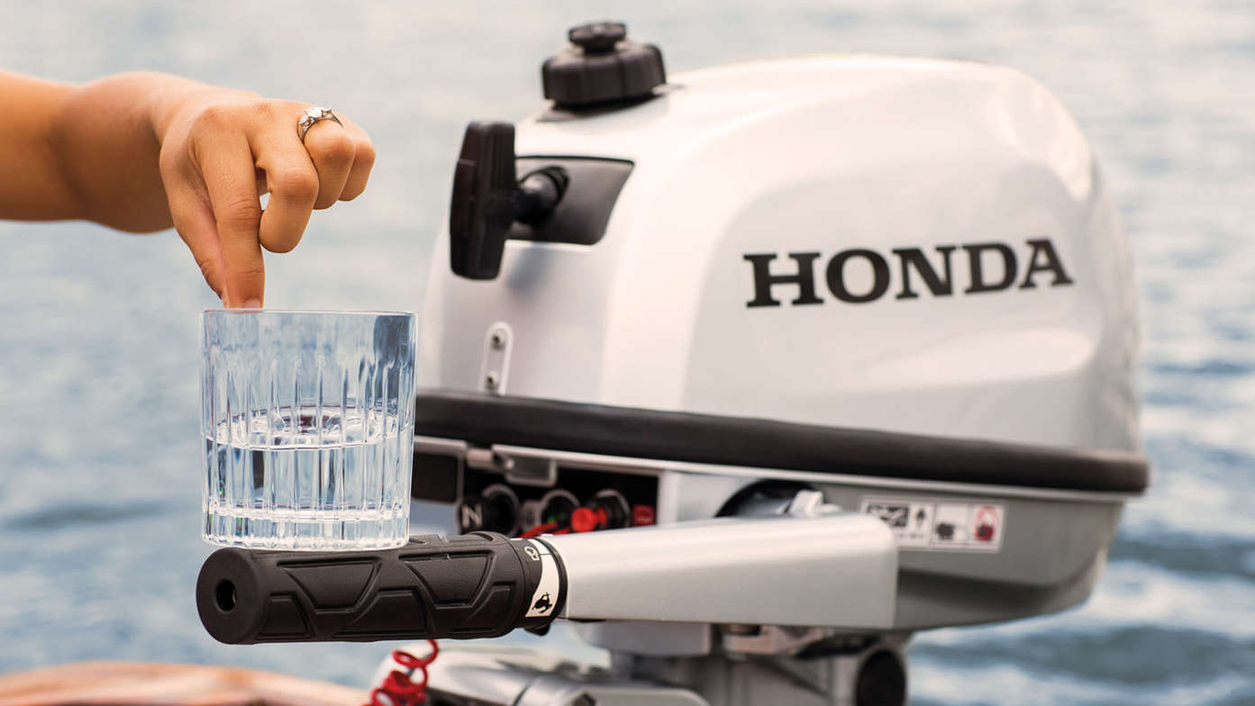 Glass of water balanced on tiller handle.