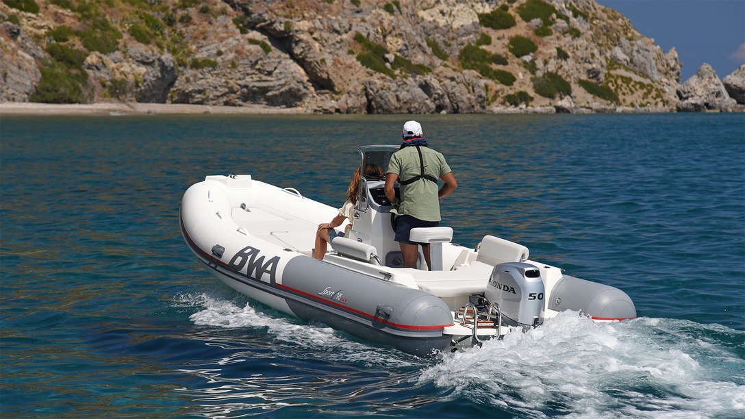 Boat using BF50 engine, being used by model, lake location.