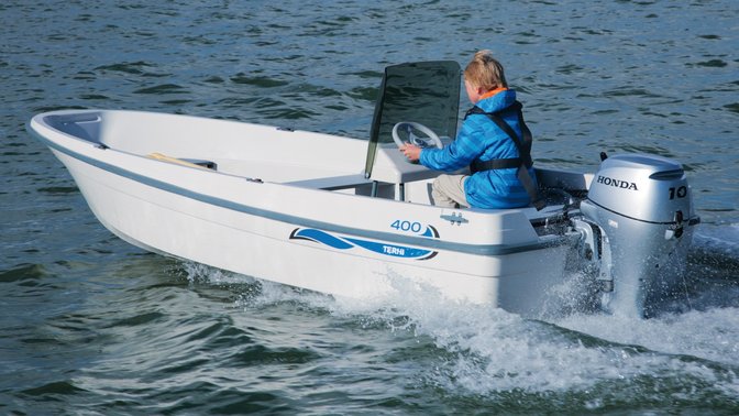 Boat with BF10 engine, being used by model, coastal location.